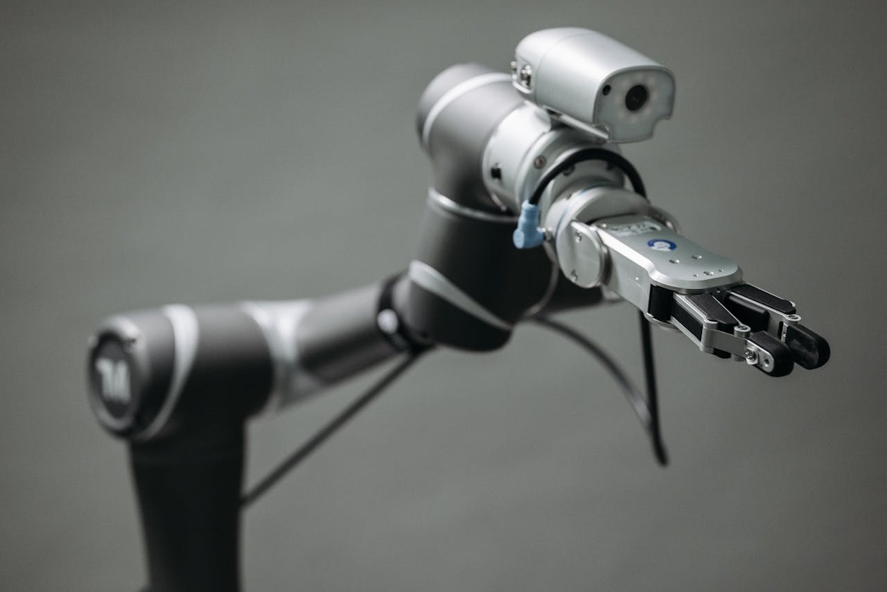 Close-up view of a robotic arm equipped with a video camera, showcasing modern technology.